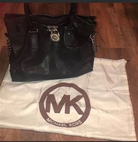 как проверить оригинальность сумки michael kors